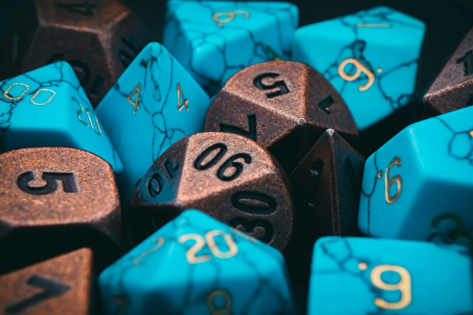 Pile of turquoise and copper polyhedral dice